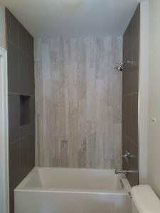 bath with custom tile wall accents
